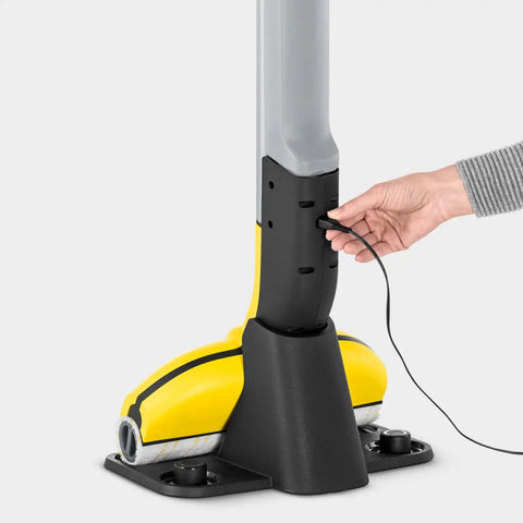 Hand connects charger to Cordless Hard Floor Cleaner With Mop Function FC 3 For Wood Laminate Tile Vinyl And Stone Floors, Powerful 500 RPM Drive