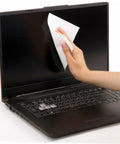 Hand using Heavy Duty 600 Count Dustless Lab Wipes For Camera Lenses And Precision Gear Oil Absorbent Cleanroom Cleaning Pads on laptop screen.