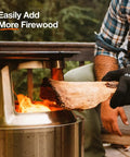 Bonfire Grill Top And Hub Cast Iron Cooktop With Stainless Steel Hub for 8 Inch Elevation Add On in use with firewood