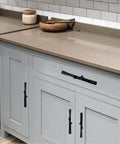 8 Pack Black Twig Branch Cabinet Knobs and Rustic Drawer Pulls Set installed on a gray farmhouse kitchen cabinet.
