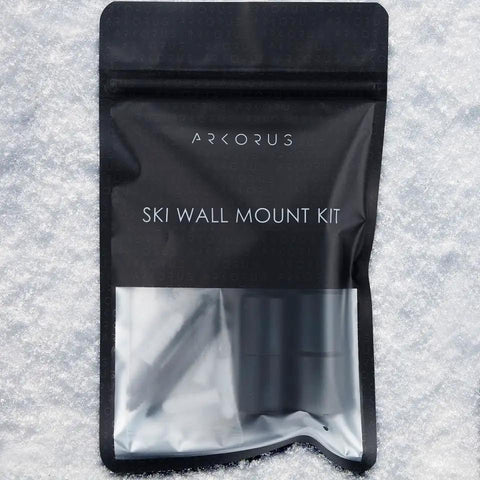 Heavy Duty Ski Wall Mount Storage Rack Eight Pack Edge Safe Vertical Hangers Modern Industrial Design in packaging on snow.