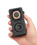 Front view of black aluminum alloy Apple Watch case (49mm) with retro click-wheel design, held in hand.