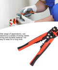 Red Automatic Wire Stripping Pliers High Carbon Steel Multi Functional Cable Cutting Tool For Efficient Electrical Repair And Machine Maintenance Work Perfect For Pro Mechanics in use, cutting wire with precision.