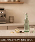 Compact Keychain Multitool for Quick On-The-Go Adjustments on counter next to bottle and glass