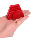 Close-up of a red plastic piece from the 12 Piece Modular Wrench Storage Rack Tool Organizer Space Saving Plastic Tray For Garage Workshop Home Use Grab And Go Easy Access Durable Stackable Organizer For DIYers And Pros, shown in hand.