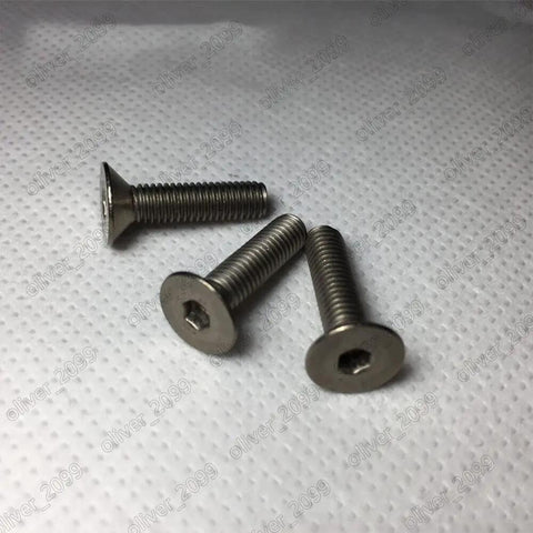 Top Shelf Titanium GR2 Hex Socket Flat Head Screws Metric Fine Thread Heavy Duty Aircraft Grade fasteners on white background.