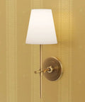Hella Glam Farmhouse Stripe Gold Metallic Wallpaper With Textured Fibrous Grain Easy Glide Paste The Wall Covering Usa Crafted Eco Clean Next Level Shine Strips For Cozy American Homes Today with wall sconce and gold background.