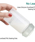 Wide Neck Glass Breastmilk Collection And Storage Bottle Four Pack Six Ounce with Silicone SureSeal Sealing Disk in hand.