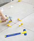 Installing tiles with Pro Grade Tile Leveling System Kit With Pliers, 1500 Clips And 300 Reusable Wedges Plus Rubber Mallet