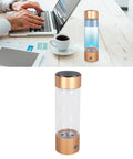 Portable Hydrogen Water Bottle With Nasal Inhalation Hose 410ml on desk, next to laptop and coffee cup, showcasing ease of use.