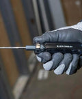 Worker holding Six In One Tapping Tool For Quick Thread Repair And Re threading, Reforms Burred Threads, Cleans Obstructions