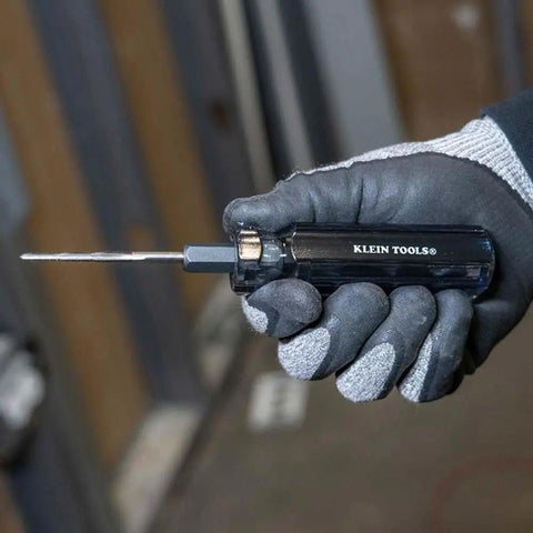 Worker holding Six In One Tapping Tool For Quick Thread Repair And Re threading, Reforms Burred Threads, Cleans Obstructions