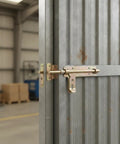 Heavy Duty Galvanized Steel Slide Bolt Latch For Garden Gates Barn Doors And Storage Sheds Rust Resistant Zinc Plated Security Lock on a metal door.