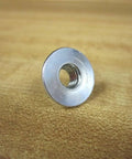 Hex Nut Fastener 5/16-18 Coarse Thread Pack of 6, PN 3842523561, shown in close-up on wooden surface