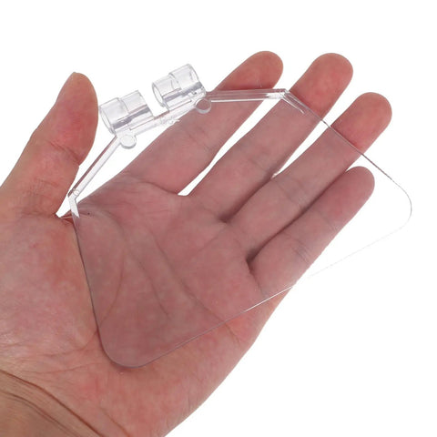 Hand holding a clear plastic piece from Dustproof 6-Inch Bench Grinder Eye Shield Guard Kit, Reusable Eye Shields 2-Pack for Grinding Machines.