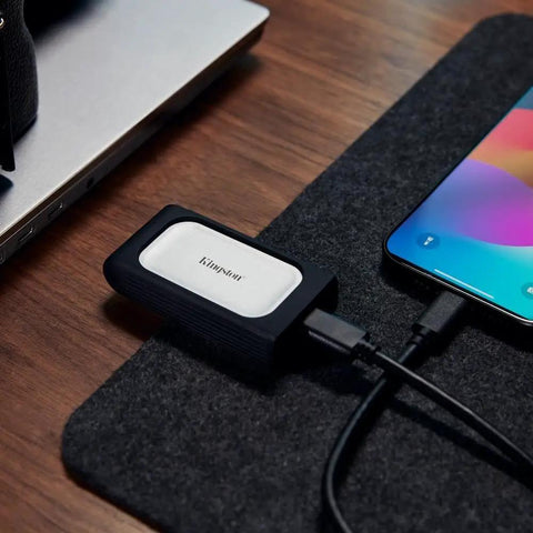 XS2000 500GB Ultra Fast Dope Speeds Portable SSD External Solid State Drive USB C Gen 2x2 Up To 2000 MBps connected to phone and laptop