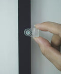 Real Deal 25 Pack Glass Retainer Clips With Screws For Cabinets Windows Doors And Mirrors Universal Clear Transparent Panel Hardware All Weather Zero Drama Install, close-up of a clear clip being held.