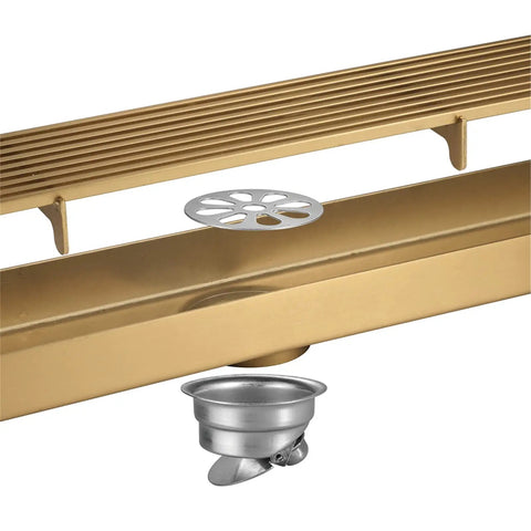 Heavy Duty Rectangular Shower Floor Drain In Sleek Brushed Gold Finish Made From Tough Stainless Steel With Removable Hair Catcher Grate.
