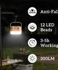 Four Pack Rechargeable Camping Lanterns With 300 Lumens, Three Light Modes, IP53 Waterproof hanging on a pole in a dark outdoor setting.