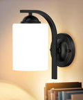 Top Tier Modern Farmhouse Wall Sconces With Solid Matte Black Frame And Soft Diffused Glass Shade Hardwired Vanity Light Fixture on wall.