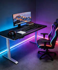 Top Shelf Electric Height Adjustable Computer Desk Featuring Memory Presets And Smooth One Touch Operation crafted for gaming, with colorful LED lights.