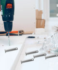 Versatile Di Kaca Stainless Steel Coupling Pins M8x40 Scaffolding Clevis Locking Bolts With Flat Head Design for easy positioning on workspace.