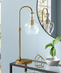 27 Inch Tall Arc Table Lamp With Seeded Glass Shade In Brushed Brass Finish For Home Or Office Desk Reading And Task Lighting on glass table