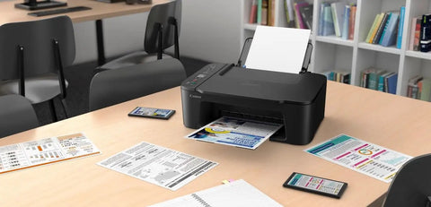 Slick Wireless All In One Home Office Printer Scanner Copier on a desk, compact design printing documents among stationery.