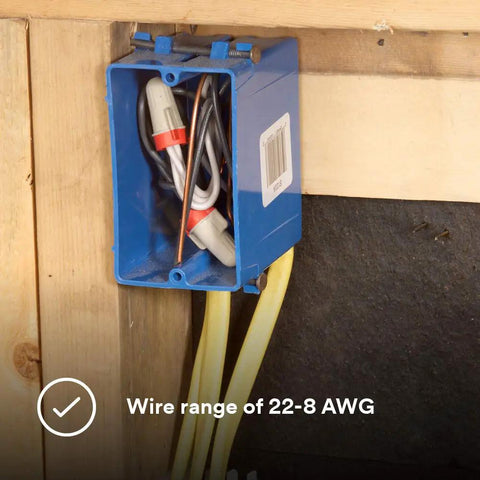 Solid As A Rock Tan And Red Wire Connectors For Twenty Two To Eight Gauge Cables in a blue electrical box on a wall.