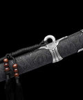 Close-up of ornate scabbard of Hand Forged Qing Dynasty Dao Sword With High Manganese Steel Blade And Alloy Fittings Wood Scabbard Wrapped In Faux Leather