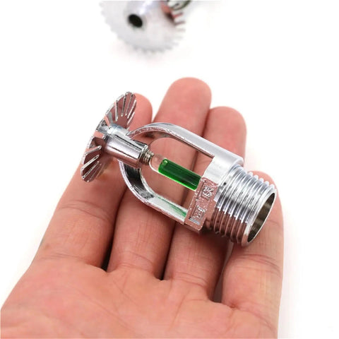 5-Pack Pendent Fire Sprinkler Heads 1/2 Inch Quick Response 93 Celsius Nickel Plated Copper With Wrench in hand.