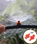 150 Piece Drip Irrigation Emitter Set With Drill Tool Micro Sprinklers 360 Degree Nozzles watering plants in garden close-up