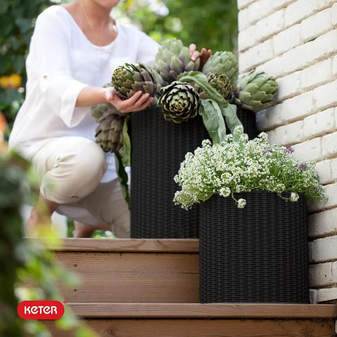 Three Sizes Rattan Resin Planter Set For Indoor And Outdoor Plants In Black With Cylindrical Design And Drainage Plug on steps
