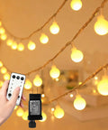 Close-up of Globe String Lights With 49.2 Feet Total Length, 100 Warm White LEDs, remote control, and plug adapter visible
