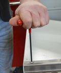 4.0mm Hex T Handle Driver 6 Inch Length Ergonomic Soft Grip Hex Key Set being used to tighten a screw on metal surface