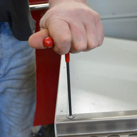 4.0mm Hex T Handle Driver 6 Inch Length Ergonomic Soft Grip Hex Key Set being used to tighten a screw on metal surface