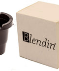 Front view of Blendin replacement K-Cup pod holder with exit needle, black plastic, beside beige box.