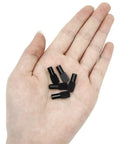 Heavy Duty 100 Pack Black Spoon Style Shelf Pins For Kitchen Cabinets And Home Bookshelves Snap Fit Adjustable Steel Pegs in a hand.
