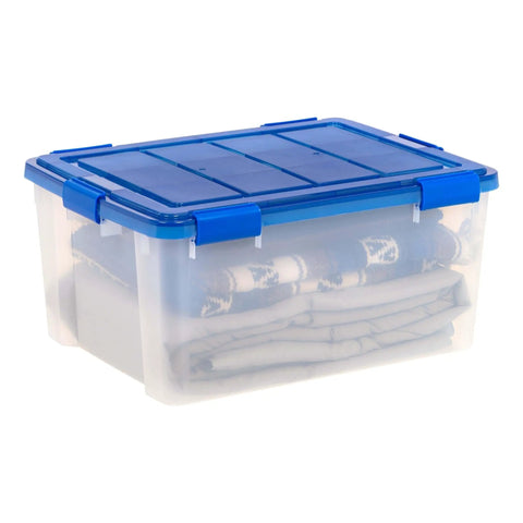 60-Quart Clear Airtight Storage Totes with Secure Latching Lid Stackable Plastic Containers for Garage Basement Closet That Are Built Different and Handle the Heat like Pros with folded blankets inside.