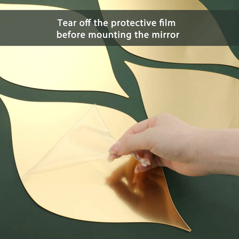 Hand peeling film from Teardrop Mirror Stickers 15 Pack Gold Wavy Acrylic Removable Wall Decals DIY 3D Art For Living Room And Bathroom