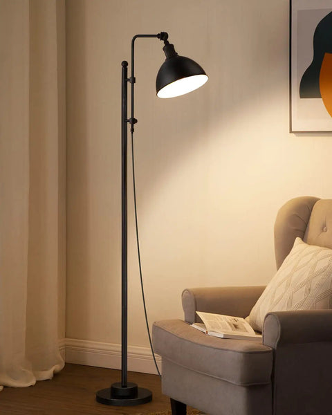 Industrial Floor Lamp With Adjustable Height And Rotating Head, Rustic Aged Black Farmhouse Metal Floor Lamp, in a cozy living room.