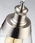 Close-up of the brushed nickel finish on Dope Handblown Seeded Glass Pendant Light with Edison bulb detail.