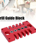 Punch Positioner Dowel Jig 3-In-1 Drill Guide Block For Woodworking, red aluminum, shown on a woodworking table.
