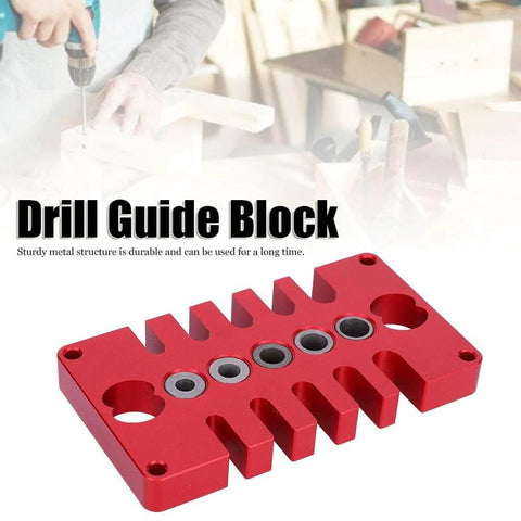 Punch Positioner Dowel Jig 3-In-1 Drill Guide Block For Woodworking, red aluminum, shown on a woodworking table.