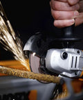No Hassle Heavy Duty Cordless Angle Grinder With 20 Volt Lithium Ion Battery in action, cutting steel with sparks flying.