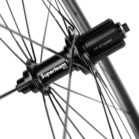 Close-up of Superteam hub on Kickass Tubeless Ready Carbon Fiber Wheelset For 700c Road Bikes Toray T700 Build UCI Approved