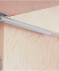 Heavy Duty Automatic Door Closer With Aluminum Alloy Body, Smooth Soft Close, mounted on top of a wooden door, holds up to 60kg.