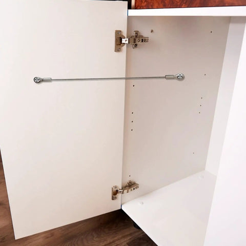 Premium Tough As Nails Stainless Steel Cabinet Door Stops And Hinge Limiters installed on a white kitchen cabinet door.
