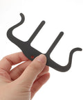 Hand holding Music Sheet Clip Page Holder No Hassle With Dual Sides And Central Clamp Travel Friendly Piano Page Clip For Easy Page Turning Secure Sheet Music Includes Three Metal Notebooks Great For Practice At Home Or On The Go.