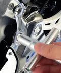 Heavy Duty Folding Socket Wrench Set Featuring Four Precision Cut Openings For Tight Squeezes And Faucet Repair Solid Steel Construction being used on a plumbing fixture.
